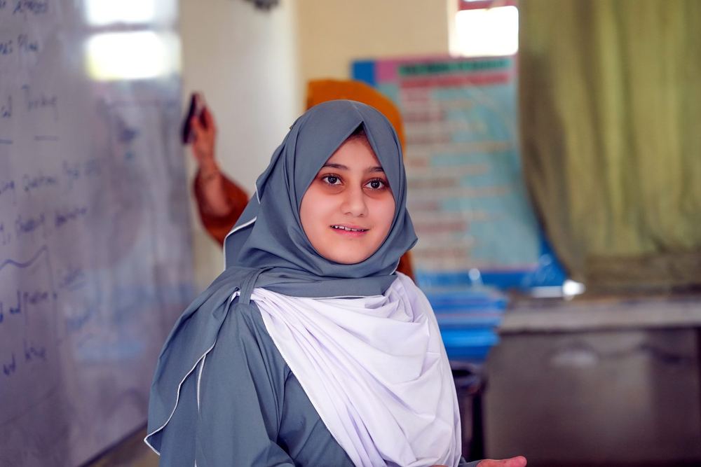 Hiba smiles in her classroom at the Muslim Hands School of Excellence